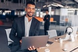 Man 30s smiling professional laptop GettyImages-1437923297