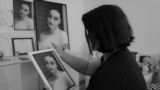 Milihate Cokli looks at a portrait of her daughter, Erona, who was murdered in April by her ex-husband.