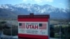 FILE - A scoreboard at the University of Utah promotes Salt Lake City's bid to host another Winter Olympics in 2034 in Salt Lake City, Utah, April 10, 2024. 