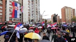 Several thousand ethnic Serbs rally in Mitrovica, Kosovo, on Nov. 6, 2022, to protest Kosovo's decision to gradually ban Serbia-issued license plates. The ban has angered Kosovo Serbs, most of whom do not recognize Kosovo's 2008 declaration of independence. The United States and its allies do recognize Kosovo as an independent country.