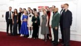FILE - Cast members pose upon arrival at the premiere for 'The Crown' season 6 finale, in London on Dec. 5, 2023. Even when hit TV series such as "The Crown" or "Bridgerton" have wide appeal, Netflix still tries to cater to the divergent tastes in its vast audience.
