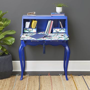 a blue table with books on it