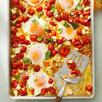 tomato and feta baked eggs on a sheet pan