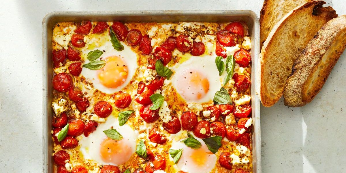 tomato and feta baked eggs on a sheet pan
