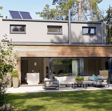 home energy tax credits 2024, modern detached house with terrace and garden