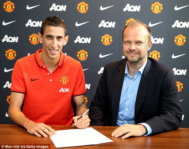 Sign here, please: Di Maria signed for United in a £60million British record fee move