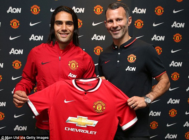 Radamel Falcao poses with the Manchester United shirt and assistant manager Ryan Giggs