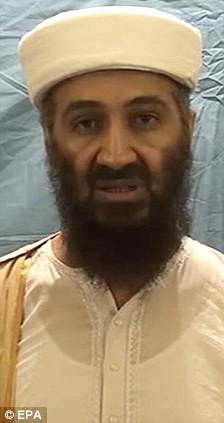 Bin Laden: Pictured in his light coloured clothing
