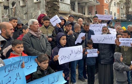 Palestinians living in Jabalia refugee camp stage a demonstration over food shortages caused by Israel's attacks and the lack of humanitarian aid in Gaza on Friday.