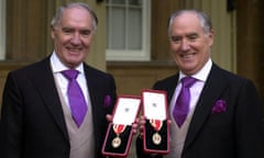 Sir David Barclay (left) and his twin brother, Sir Frederick, after receiving their knighthoods at Buckingham Palace, 2000