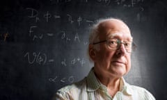 Prof Peter Higgs in his old office at Edinburgh University with a description of the Higgs model, written by him on the blackboard.