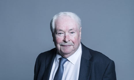 Doug Hoyle posing for head-and-shoulders photograph in a suit