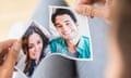 Woman tearing a picture of herself and an ex-boyfriend in half