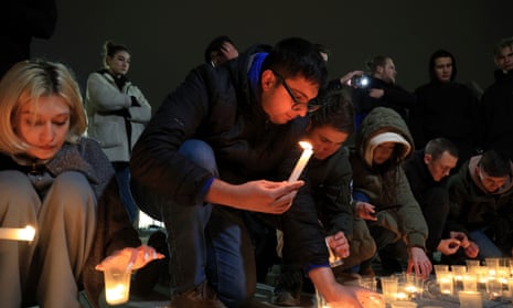 People light candles in memory of the victims of the terrorist attack in Moscow, in the center of in the center of Simferopol, in Russian-held Crimea.