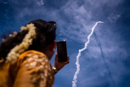 A member of the public in Andhra Pradesh watches the launch of the Chandrayaan-3 rocket to the moon.