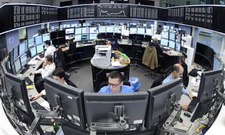 Traders work at the stock exchange in Fr