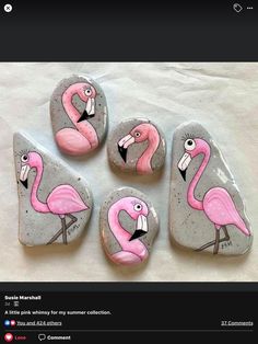 four pink flamingos painted on rocks in the shape of hearts