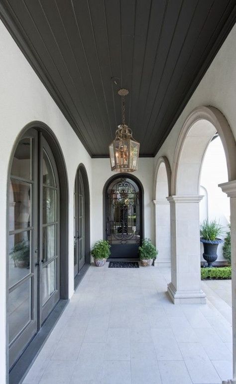 The power of painted ceilings Mediterranean Porch, Arched French Doors, Dark Ceiling, Porch Design Ideas, Porch Ceiling, 카페 인테리어 디자인, Casas Coloniales, Spanish Style Homes, Mediterranean Decor