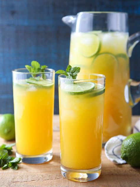 This mango pineapple punch is a sunny drink the whole family will love! Since I’m not on a beach someplace far away laying in the warm sun (but oh, how I wish I was!), I have to do my best to bring a taste of the tropics to me. This bright and fresh non-alcoholic punch is just … Mango Punch Alcoholic, Tropical Punch Non Alcoholic, Mango Pineapple Refresher, Alcoholic Punch Recipes, Non Alcoholic Punch, Completely Delicious, Mango Drinks, Alcoholic Punch, Pineapple Punch