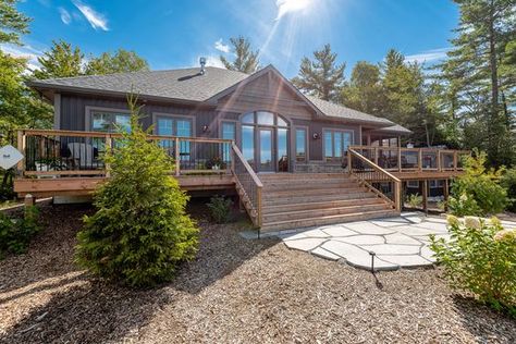 Quality Homeowners, Denise & Graham, share their cottage building journey. Read more to find out why they chose our popular Rosseau design for their lakefront property in Muskoka. Lakefront Bungalow, Lakefront House Plans, Cottage Building, Concrete Interior Design, Modular Home Builders, Custom Modular Homes, Bungalow Cottage, Cabin Loft, House Plans Open Floor