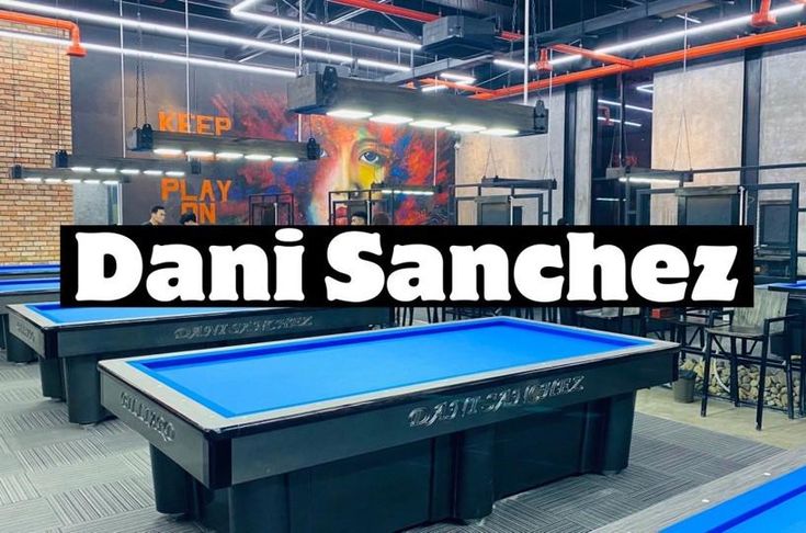 an indoor ping pong table with the words dani sanchez above it