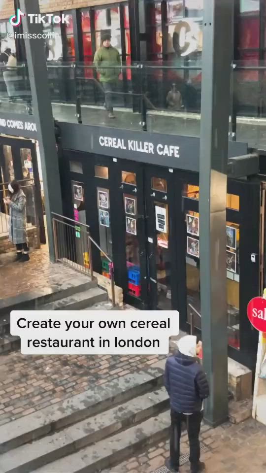 This may contain: an image of people walking down the street in london with text that reads create your own cereal restaurant in london