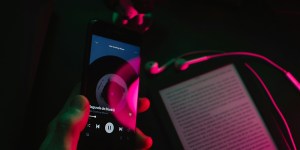 Audiobook inclusion is a Spotify scam | App on iPhone with Kindle in the background