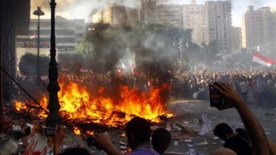 Opponents of Egyptian President Mohamed Morsi burn the content of a Freedom and Justice Party office in the coastal city of Alexandria on June 28, 2013