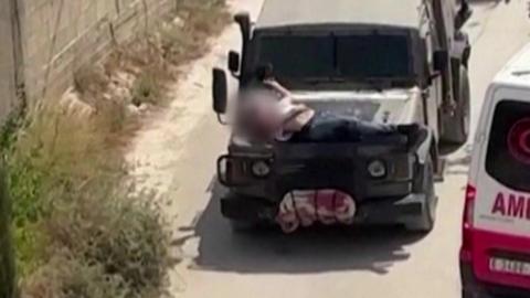 Video showing Palestinian man strapped to front of jeep