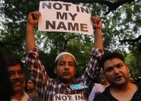 EPA Indian people hold placard during a "Not in my Name" protest against spate of anti-muslim killings in India,in New Delhi, India, 28 June 2017