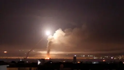 Reuters Missile fire seen over Damascus on 10 May 2018