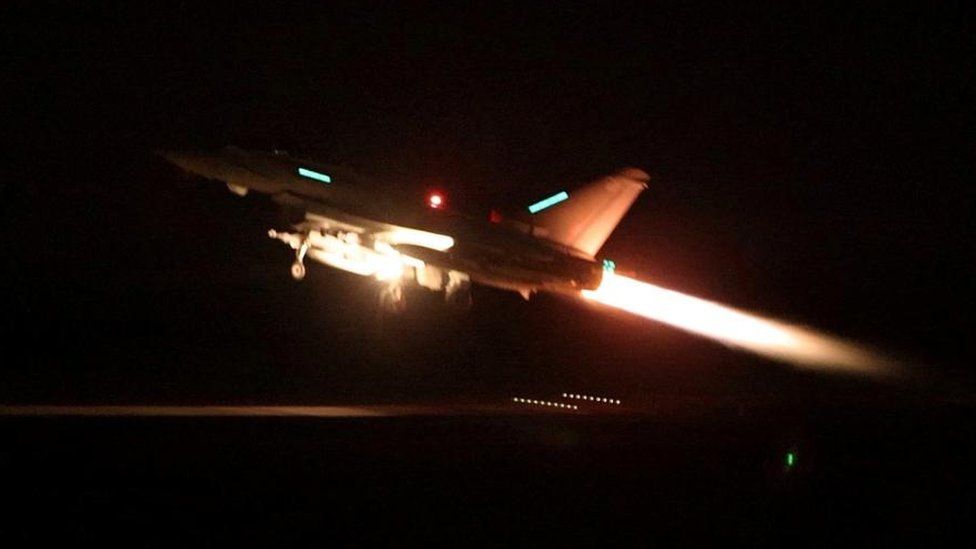 An RAF Typhoon aircraft takes off at night ahead of strikes on Houthi positions in Yemen