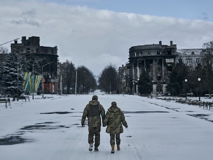 Ukrainian soldiers walk along a street in Bakhmut, Donetsk region, Ukraine, Sunday, Feb. 12, 2023.