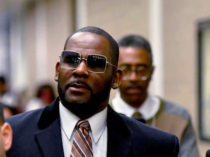 R. Kelly, center, leaves the Daley Center after a hearing in his child support case May 8, 2019, in Chicago.