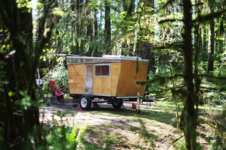 Architect Douglas Peterson-Hui built his camper on a trailer purchased at Costco. Its angled structure and plywood exterior feel simultaneously vintage and modern.