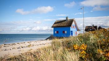 Blaues Ferienhaus am Strand von Heiligenhafen mit Blick auf die Ostsee Heiligenhafen, Schleswig-Holstein, Kreis Ostholst