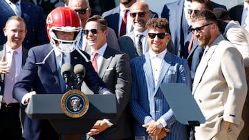 U.S. President Joe Biden wears a helmet gifted to him by the Kansas City Chiefs as he welcomes them to the White House to celebrate their championship season and victory in Super Bowl LVIII, in Washington, U.S., May 31, 2024. REUTERS/Evelyn Hockstein