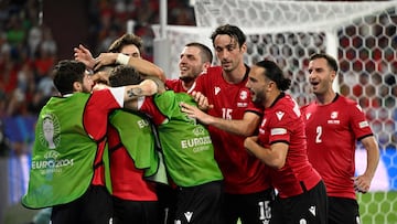 Georgia's players celebrate the second goal during the UEFA Euro 2024 Group F football match between Georgia and Portugal at the Arena AufSchalke in Gelsenkirchen on June 26, 2024. (Photo by INA FASSBENDER / AFP)