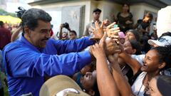 Venezuelan President Nicolas Maduro greets supporters during a march of evangelical Christinas in defense of the original family model marking Family Day, in Caracas, Venezuela, Wednesday, May 15, 2024. (AP Photo/Ariana Cubillos)