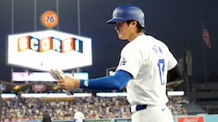 May 21, 2024; Los Angeles, California, USA; Los Angeles Dodgers designated hitter Shohei Ohtani (17) returns to the dugout after scoring in the sixth inning against the Arizona Diamondbacks at Dodger Stadium. Mandatory Credit: Kirby Lee-USA TODAY Sports