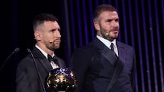 Inter Miami CF's Argentine forward Lionel Messi (L) holds his trophy on stage as he receives his 8th Ballon d'Or award next to Former English football player and Inter Miami's co-owner David Beckham during the 2023 Ballon d'Or France Football award ceremony at the Theatre du Chatelet in Paris on October 30, 2023. (Photo by FRANCK FIFE / AFP)