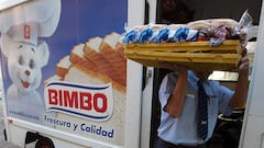A Grupo Bimbo employee, carries some products for delivery to a restaurant in the Zona Rosa area in Mexico city, Mexico on Thrusday Feb.14, 2013. Bimbo a Mexican company that is the world's largest bread baker Photographer: Susana González/Bloomberg