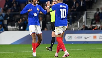France's forward #10 Kylian Mbappe (R) celebrates with France's forward #25 Bradley Barcola after scoring his team's third goal during the International friendly football match between France and Luxembourg at Saint-Symphorien Stadium in Longeville-les-Metz, eastern France, on June 5, 2024. (Photo by Jean-Christophe VERHAEGEN / AFP)