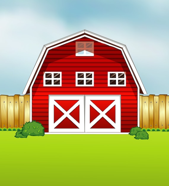 Czerwony styl kreskówka stodoła na tle zieleni i nieba