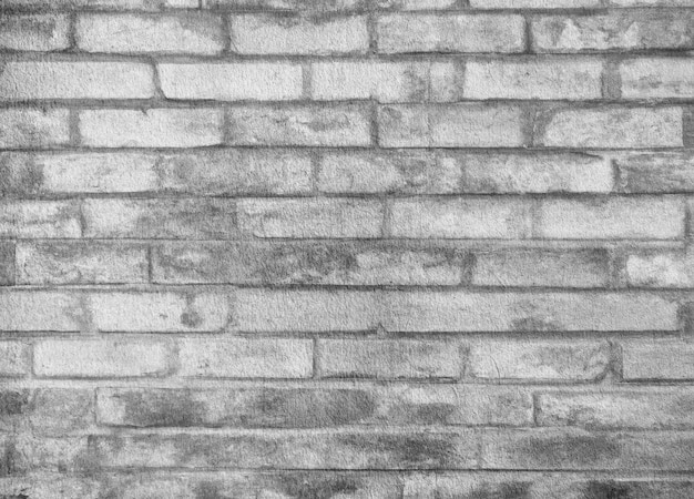 Foto textura de pared de ladrillo gris grunge o papel tapiz