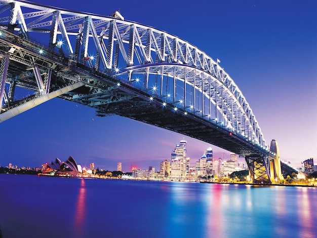 Foto uma ponte que tem uma ponte que diz sydney harbour