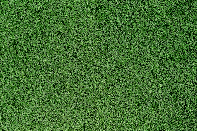 Foto vista superior textura de fondo del campo de fútbol de hierba artificial