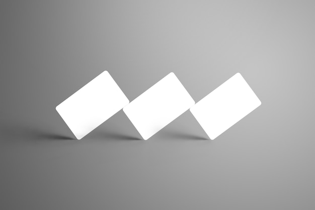 Cartões-presente universais de três bancos brancos em um canto isolado em uma superfície cinza. Pronto para ser usado em seu projeto.