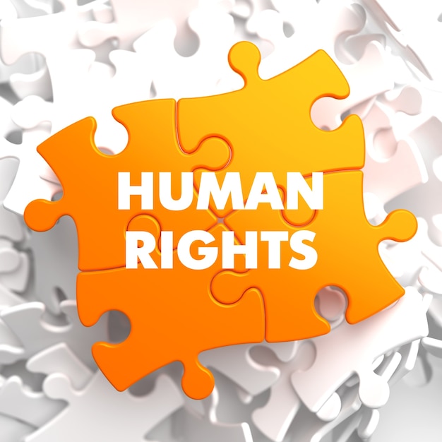 Foto derechos humanos en orange puzzle on white.