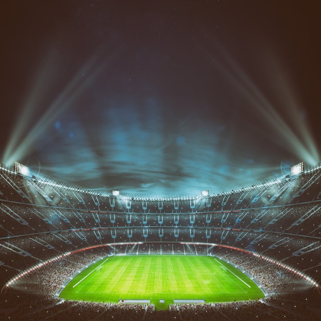 Foto estadio de fútbol con gradas llenas de fanáticos esperando el juego nocturno.